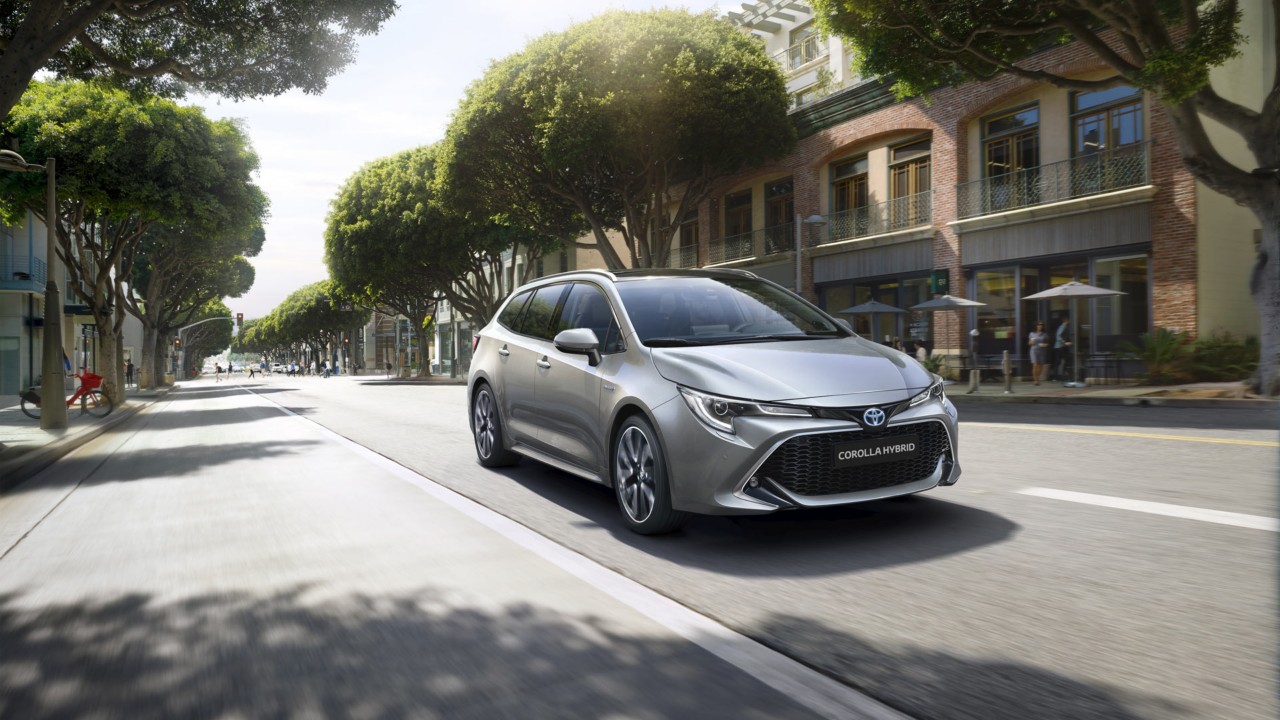 Toyota Corolla Hatchback driving down the road