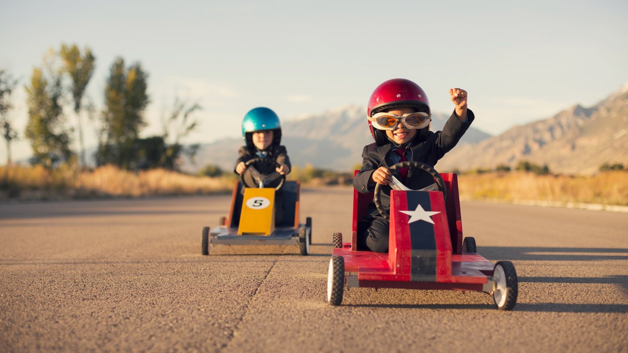 Children racing go karts