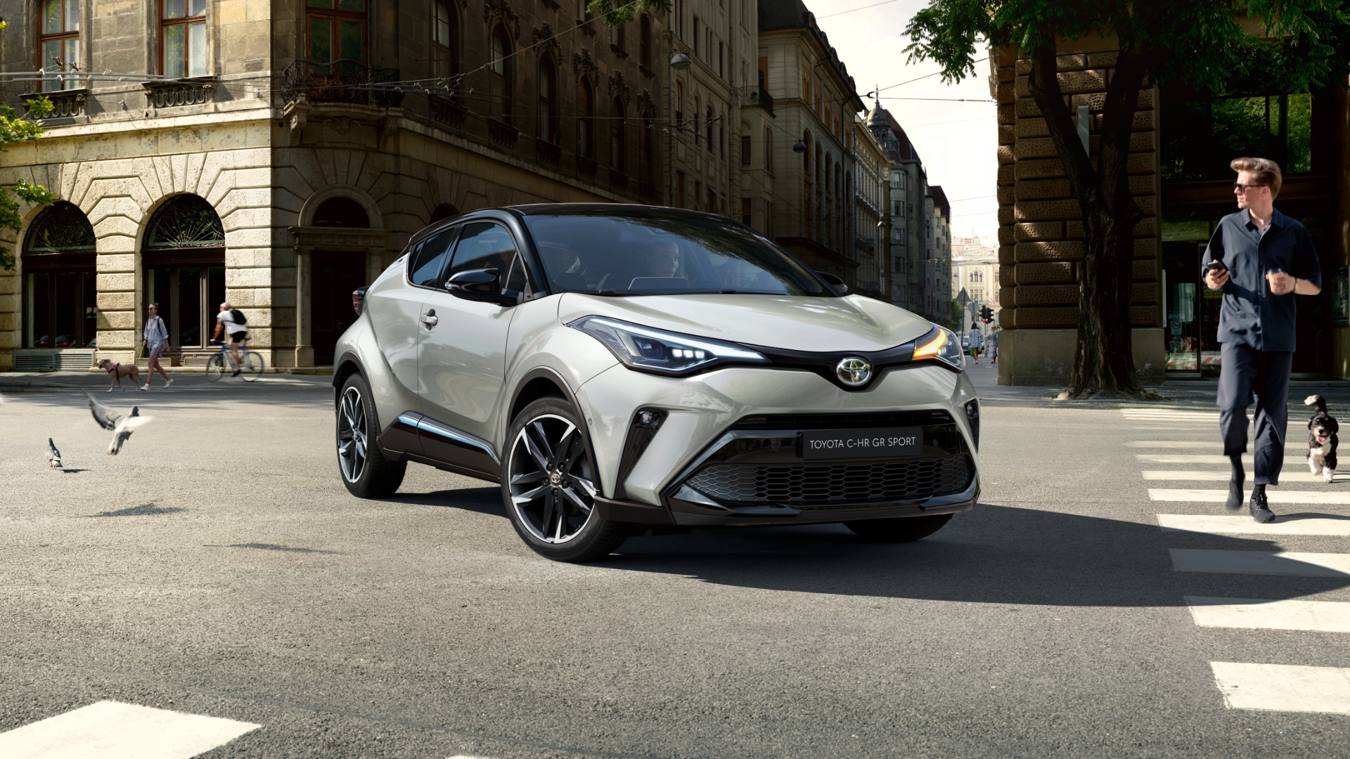 toyota-chr-driving-along-road-people-staring-1920x1080-1