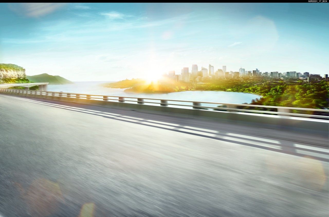 Road overlooking a city and bay