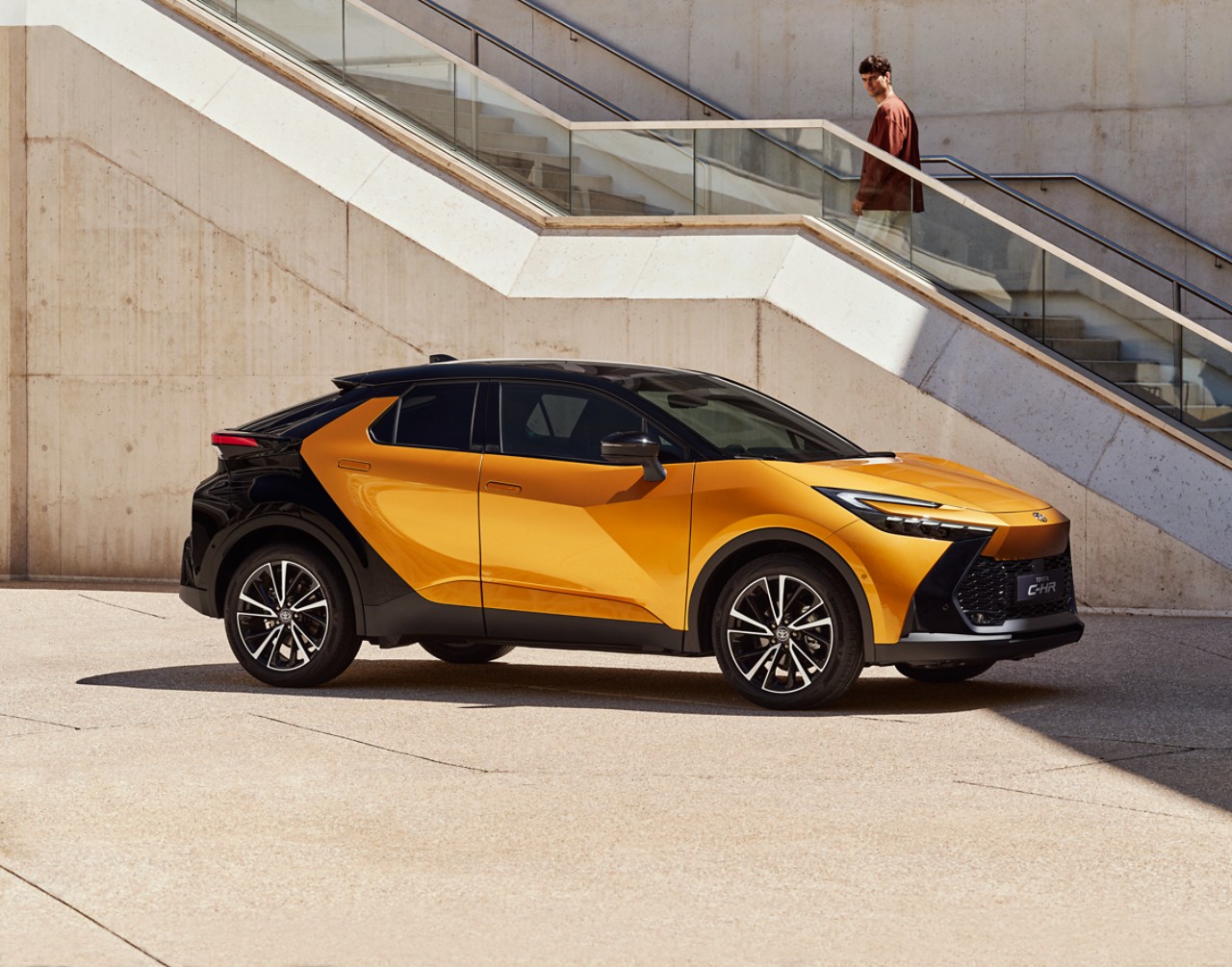 Toyota Corolla Hatchback driving down the road
